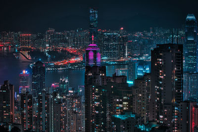 Illuminated modern buildings in city at night