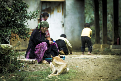 Rear view of woman with dog