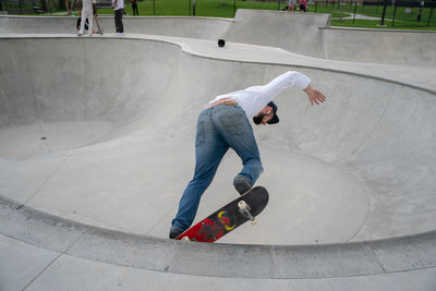 Full length of man skateboarding on skateboard