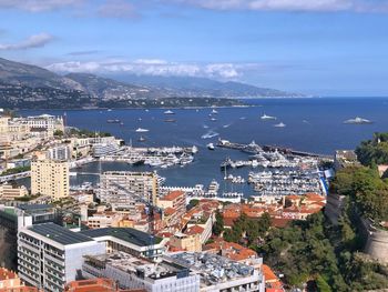 High angle view of monaco city and harbor by sea against sky