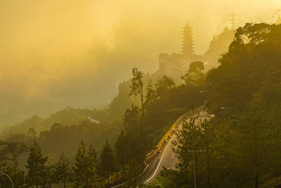 Panoramic view of city against sky during sunset