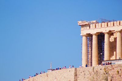 Low angle view of building against clear blue sky