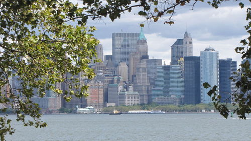 Buildings in city against sky