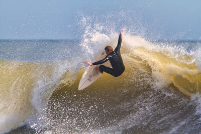 Man surfing in sea
