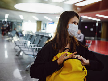 Portrait of woman standing in bus