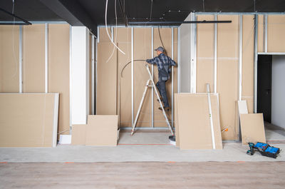 High angle view of man standing in studio