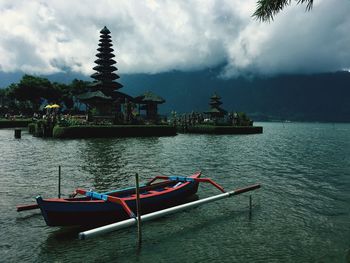 Boat in temple against sky