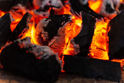 Close-up of fire burning at night