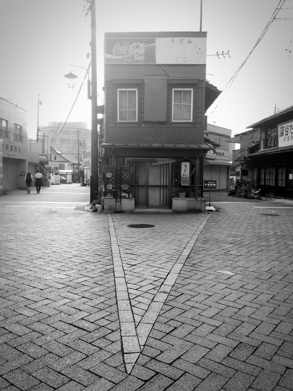 VIEW OF CITY STREET AGAINST SKY