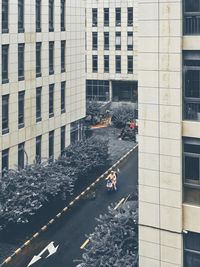 High angle view of road amidst buildings in city