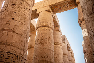 Different columns with hieroglyphs in karnak temple. karnak temple is the largest complex in egypt.