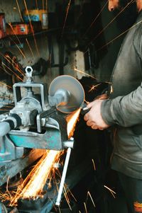 Blurred motion of people in workshop