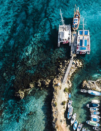 High angle view of sailboats in sea