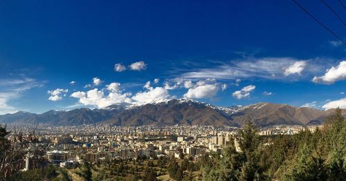 Scenic view of mountains against blue sky