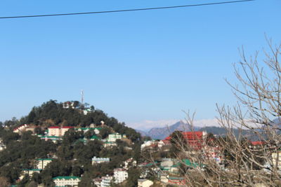 Townscape against clear blue sky