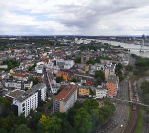 Cityscape against cloudy sky