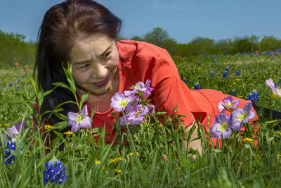 Portrait of woman on grassy field