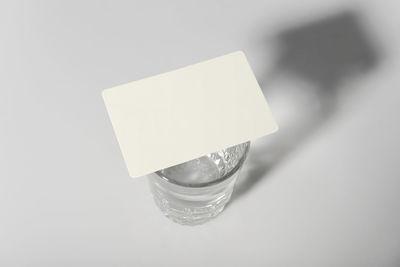 High angle view of drink on table against white background
