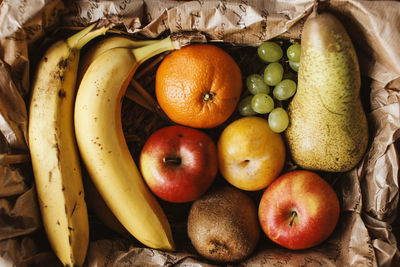 Directly above view of fresh fruits in paper bag