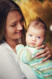Portrait of mother and baby with blue eyes