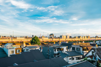 High angle view of buildings in city against sky