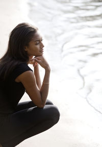 Young woman looking at sea