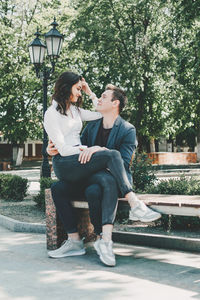 Young couple sitting outdoors