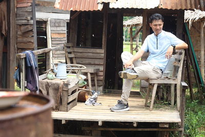 Portrait of man sitting on chair