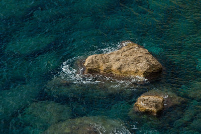 High angle view of rock formation in sea