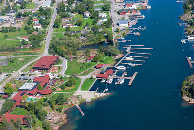 High angle view of townscape by river against buildings