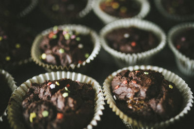 Homemade chocolate muffins with colourful toppings