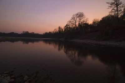 Scenic view of lake against sky during sunset