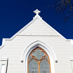 Low angle view of building against blue sky