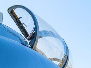 Close-up of military airplane against clear blue sky