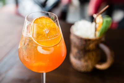 Close-up of orange juice on table