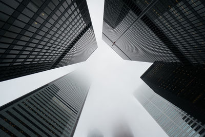 Low angle view of modern buildings against clear sky