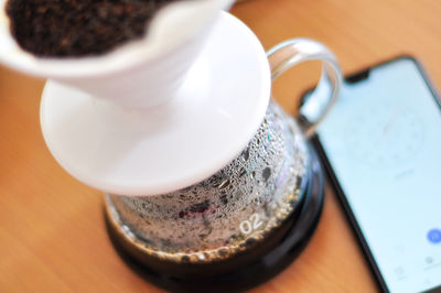 Close-up of coffee cup on table