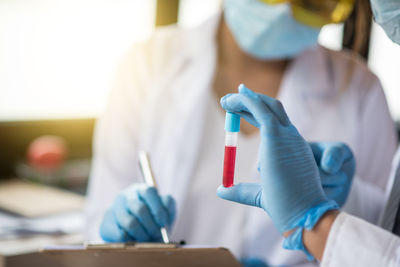 Man and woman performing experiment in laboratory