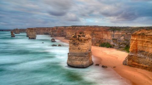 Scenic view of sea against cloudy sky