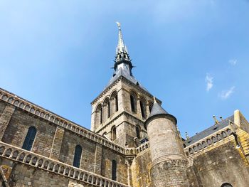 Low angle view of le mont-saint-michel against sky