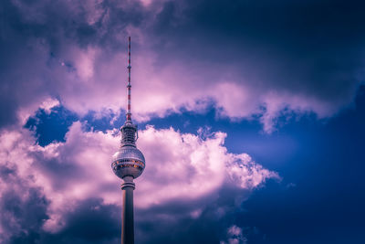 Low angle view of communications tower against sky