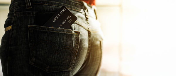 Rear view of a woman standing on book