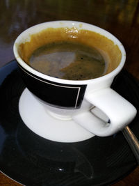 High angle view of coffee cup on table