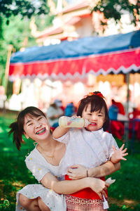 Portrait of smiling girl playing with toys