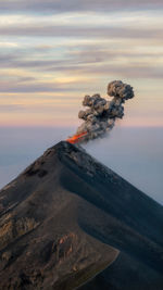 Scenic view of volcanic mountain against sky