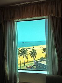 View of sea through window