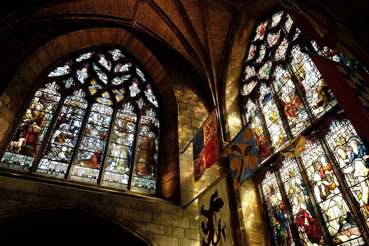 LOW ANGLE VIEW OF GLASS WINDOW IN TEMPLE