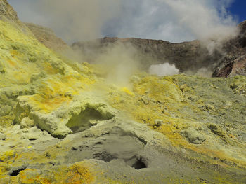 Smoke emitting from volcanic mountain