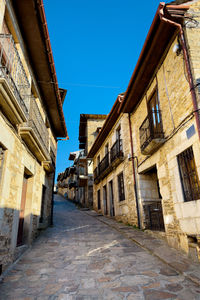 Alley amidst buildings in town