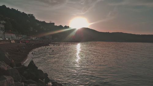 Scenic view of lake against sky during sunset